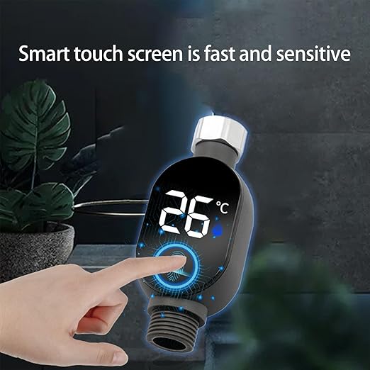 Hand touching a sensitive smart touch screen on an LED digital water temperature meter displaying 26 degrees Celsius